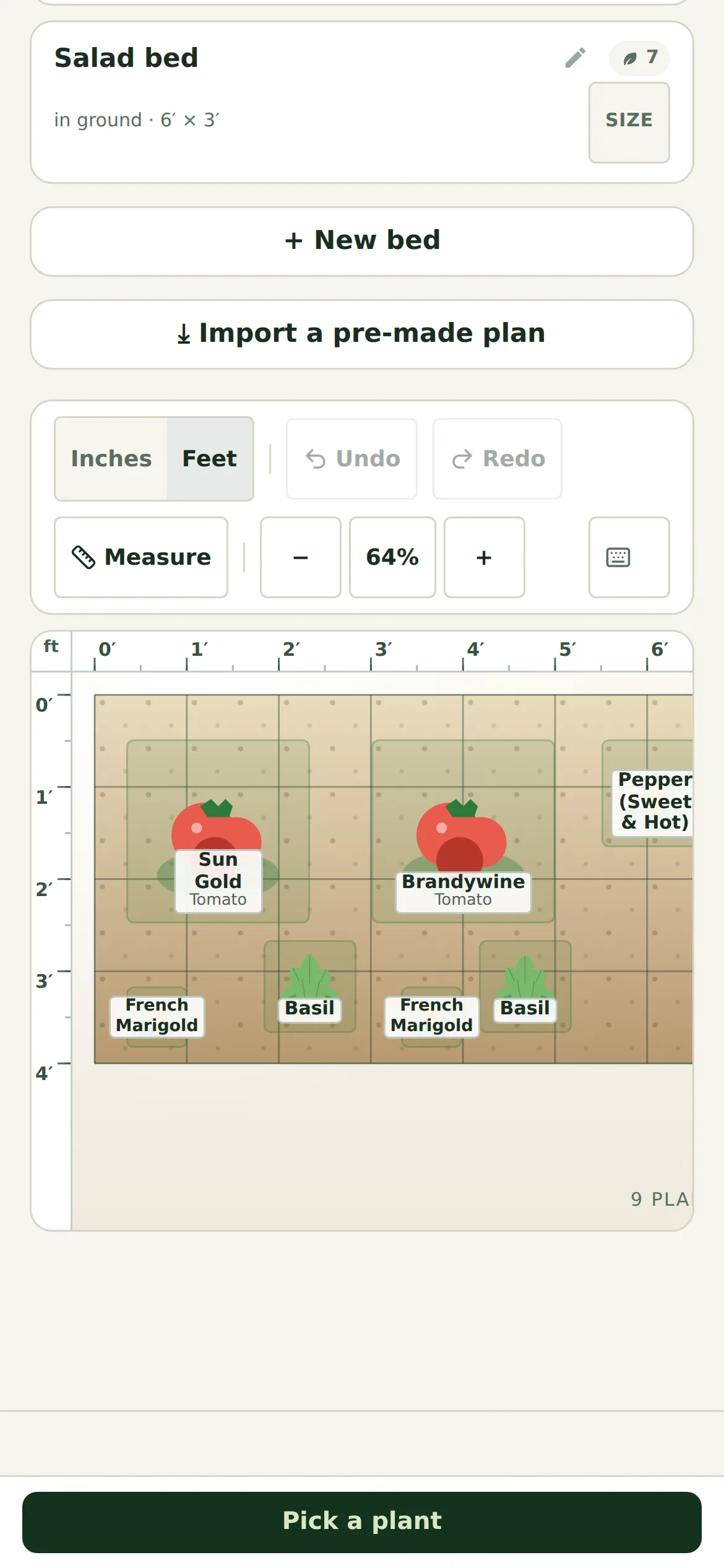 The GardenDraft editor on a phone: bed list and planting canvas with tomatoes, basil, and French marigolds, zoom controls, and a Pick a plant button pinned to the bottom of the screen